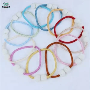 Soft pink magnetic curtain tie back with pearl ball design